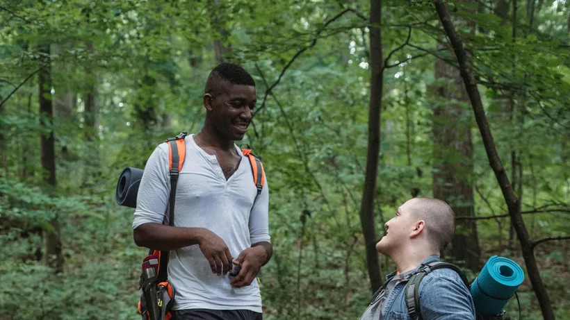 Hikers on a wooded trail